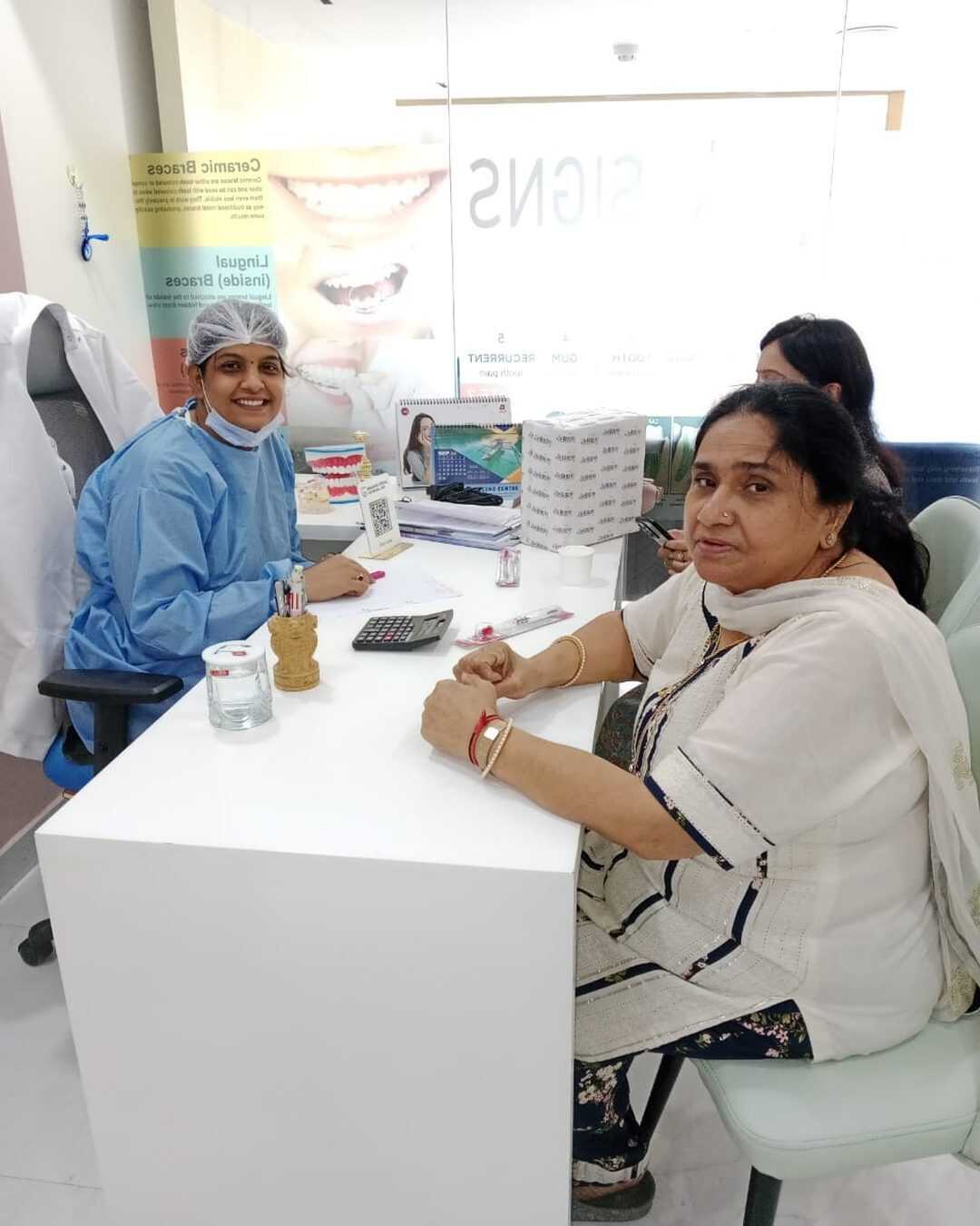 Dr. Shipra Jain consulting with a patient at Mahavirai Dental and Medical Care